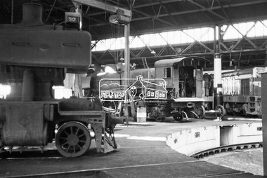 Photograph, Steam locomotives J-517, N-453 and diesel-electric locomotive T-327 in the locomotive shed, Bendigo Railway Station, c November 1962