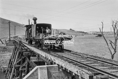Photograph, No. 6 locomotive, a Hudswell Clarke  0-4-2SToc locomotive crossing the railway trestle bridge over the Mooroobool River, Fyansford Cement Works Railway, November 1962, 1962