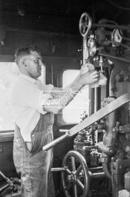 Photograph, Inside the cab of steam locomotive K-158 near the coal hopper, Echuca Railway Station, November 1963, 1963
