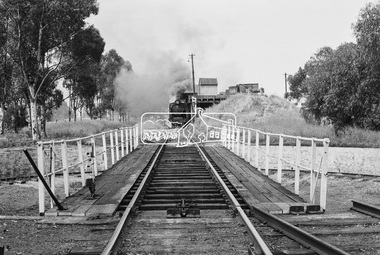 Photograph, Turntable at Echuca rail yards; steam locomotive J-500 at the coal hopper in distance, November 1963, 1963