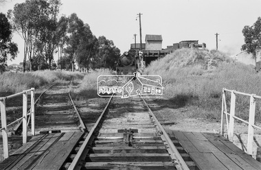 Photograph, Turntable at Echuca rail yards; steam locomotive R-727 at the coal hopper in distance, November 1963, 1963