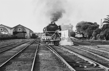 Photograph, Steam locomotive R-727 hauling goods carriages, departing Echuca Railway Station, November 1963, 1963