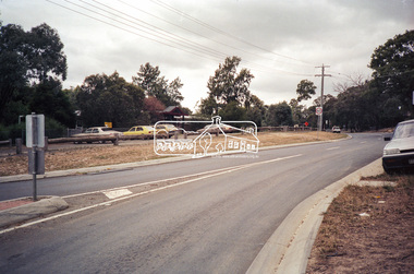 Photograph, Looking northeast across Main Road from intersection with Raglan Road, Research, c.1989, 1989