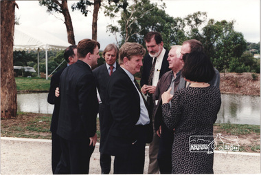 Photograph, L-R: Wayne Phillips, unknown , Robert Marshall, Rob Maclellan, John Graves, Graeme Gunn, Ian and Christine Jelbart at the launch of the Kinloch Gardens development, 93 Arthur Street, Eltham, April 1998, April 1998