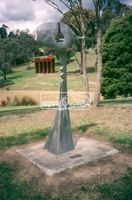 Slide - Photograph, Sculpture, Surveyor of Suburban Environs, Ernst Fries (1991), Alistair Knox Park, cnr Bridge Street and Main Road, Eltham, c.1993