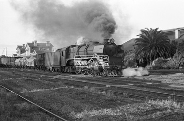 Photograph, Steam locomotive R-727 hauling goods carriages, departing Echuca Railway Station, Nov. 1963