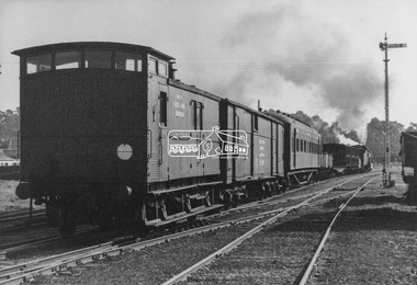 Photograph, George Coop, Steam locomotive J-502 hauling a specialist plant track repair and goods recovery train departing Echuca, Aug. 1963