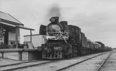 Photograph, George Coop, Steam locomotive J-507 hauling a goods train arrives at Barnes Railway Station (N.S.W.), Aug. 1963