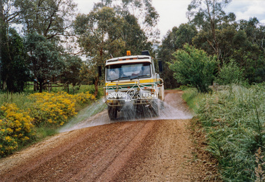 Photograph - Colour Print, Eltham Shire Council, Council oerations road grading and gravel water truck, c.1990