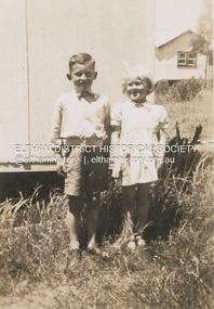 Photograph, Kenneth Ingram (jnr) and Pam Ingram by the houses at the end of Thomas Street, Eltham, c.1945
