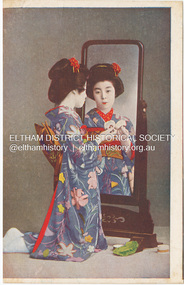 Photograph - Postcard, Geisha Sakae looking into a mirror applying makeup, c.1905 to c.1920s