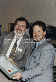 Photograph - Colour Print, Shire of Eltham, Rodney Roschellor, CEO, Shire of Eltham presents Cr. John Graves, Eltham Shire President with a framed Acknowledgement of Service by Councillors to mark the end of the Shire of Eltham through municipal amalgamation, October 1994