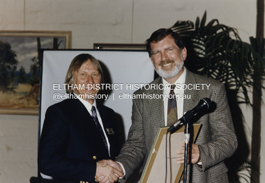 Photograph - Colour Print, Shire of Eltham, Cr. John Graves, Eltham Shire President presents Cr. Robert Marshall with a framed Acknowledgement of Service by Councillors to mark the end of the Shire of Eltham through municipal amalgamation, October 1994