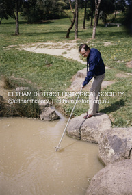 Photograph - Colour Print, Council staff officer takes a water sample in Alistair Knox Park, c.1988