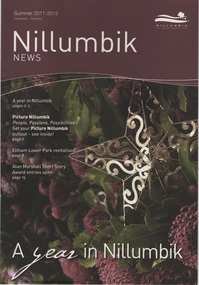 Close up image of a see through three dimensional gold star shape set in among green leaves and a dense maroon flowers 