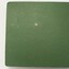 Large book of photographs in hard green cover