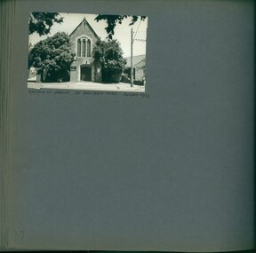 One photo on page - front of tall old church with trees on both sides of the entrance