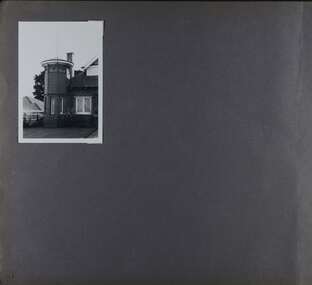 1 photo on page - view of mainly a tower, part of a large brick home