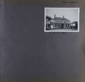 One photo on page - an old weatherboard house with a verandah