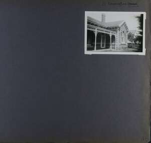 1 photo - old brick home of one storey with a verandah