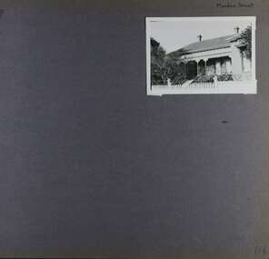 One photo of an old house with a verandah in its garden.