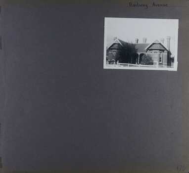 View of single storey double-fronted old home with lots of chimneys