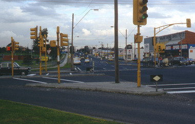 Multi road lane intersection with traffic lights.