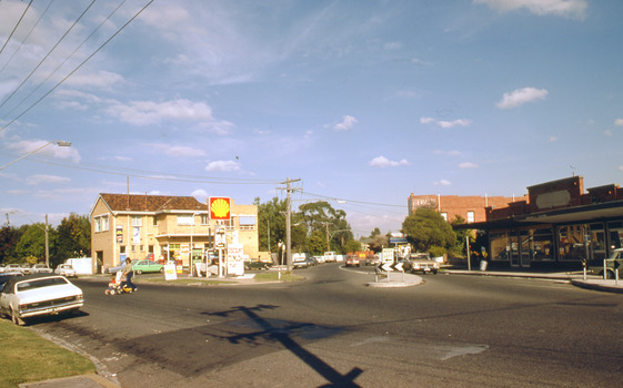 Intersection with petrol station on corner.
