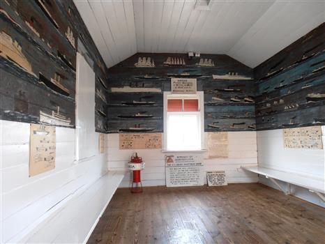 Original fishermen's waiting shed from the Queenscliff Pier containing paintings of ships most of which had passed through the heads, with a few prominent exceptions whimsically added [eg Titanic].  paintings attributed to Henry Zanoni, a prominent local fisherman. The shed and paintings are listed by the Victorian Heritage database.