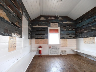 Original fishermen's waiting shed from the Queenscliff Pier containing paintings of ships most of which had passed through the heads, with a few prominent exceptions whimsically added [eg Titanic].  paintings attributed to Henry Zanoni, a prominent local fisherman. The shed and paintings are listed by the Victorian Heritage database.