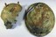 Oval Tray which is badly tarnished through and badly damaged in various areas. Contains green corrosion layers and some encrustation.