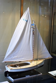 Top rear view of wooden model in glass case.  The model is of a couta boat 'Maud' which was made by Malcolm Gibson in 2012 in Geelong.