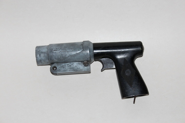 A flare firing pistol shown side on.