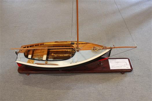 Top view of model showing one side in raw timber and one half in final painted finish. 