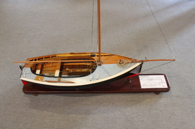 Top view of model showing one side in raw timber and one half in final painted finish. 