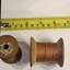 2 wooden cotton reels with thread