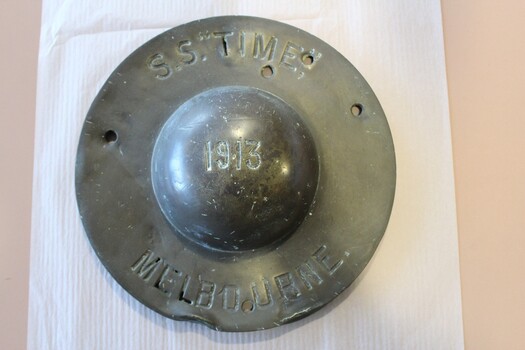 Brass ship's wheel cover inscribed with SS Time 1913