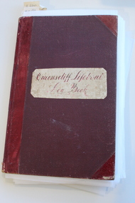 Red bound log book with label reading: 'Queenscliff Lifeboat Log Book'. Log book contains operational notes, reports and lifeboat crews from the Queenscliff Lifeboat from 1893 to 1909