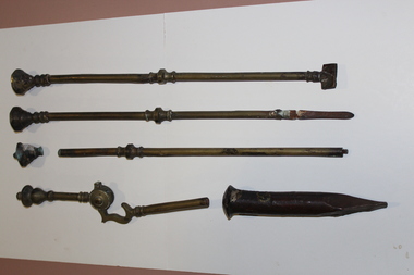 View of a collection of brass fireplace implements