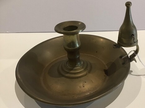 Brass candle holder with wax catcher and candle snuffer