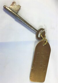 A key with a brass tag: Main Deck STBD G Kermode.