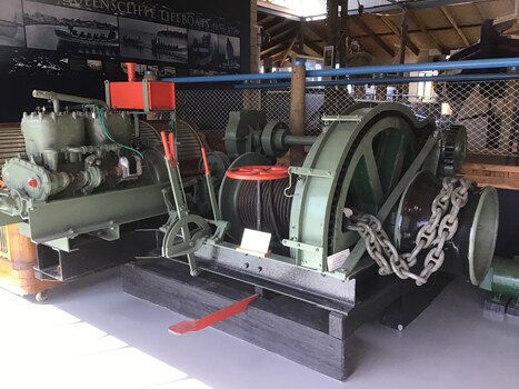 A winch and motor painted green used to retrieve the lifeboat Queenscliffe from the water.