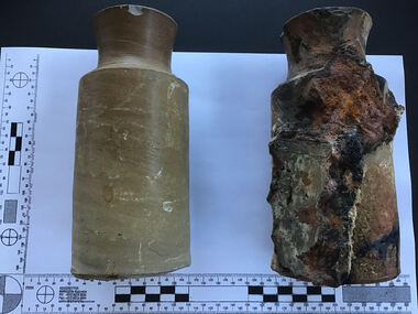 Two earthenware containers, one with encrustation and concretion  