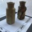 Two earthenware containers one with encrustation and concretion  