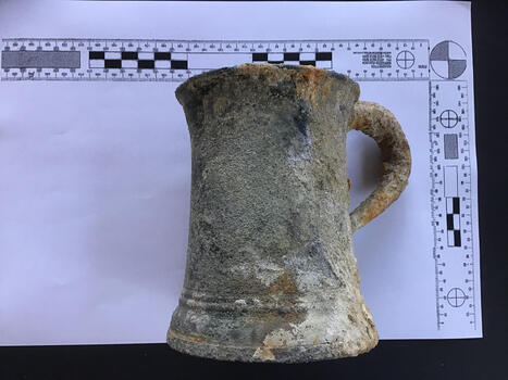 Side view of encrusted pewter tankard