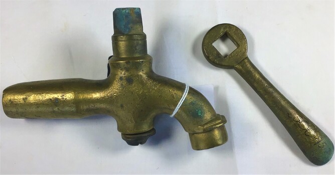 A brass tap with handle