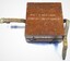Timber box inscribed with: Patt 5 Heeling Error Instrument on lid and 0-486 on the side. Two leather straps with a buckle attached to two sides of the box.side