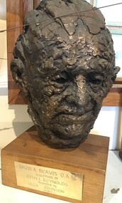 Bronze sculpture mounted on wooden base with an inscription: Plaque: David A. Beavis O.A.M. Sculpture by Ethel Reynolds Presented by Olga Johnson 1985