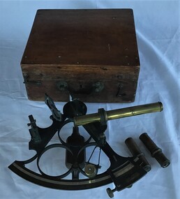 A sextant in wooden box as used by P. J. Larkin, government marine surveyor.