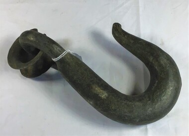 Large metal hook with chain or rope link attached.